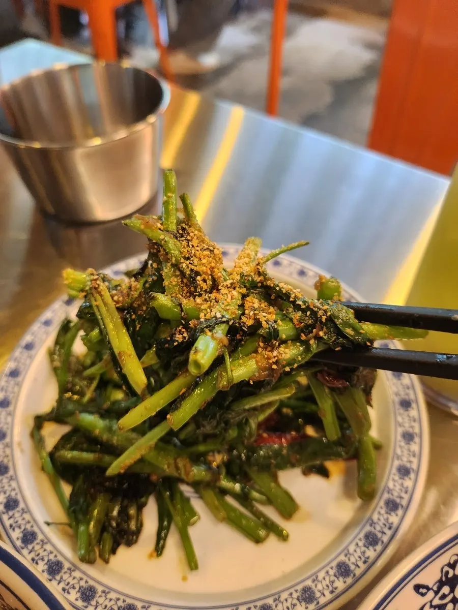 A plate of hawker bite stir-fried kang kong