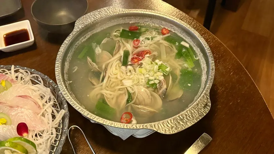 A plate of TATSU SUSAN's Wando large halibut sashimi