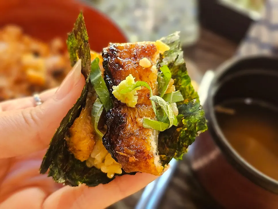 Eel rice bowl with seaweed and wasabi condiments added