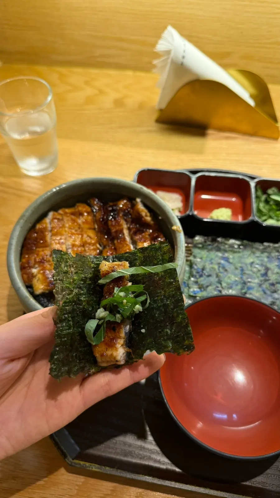 First bowl portioned out with just eel and rice