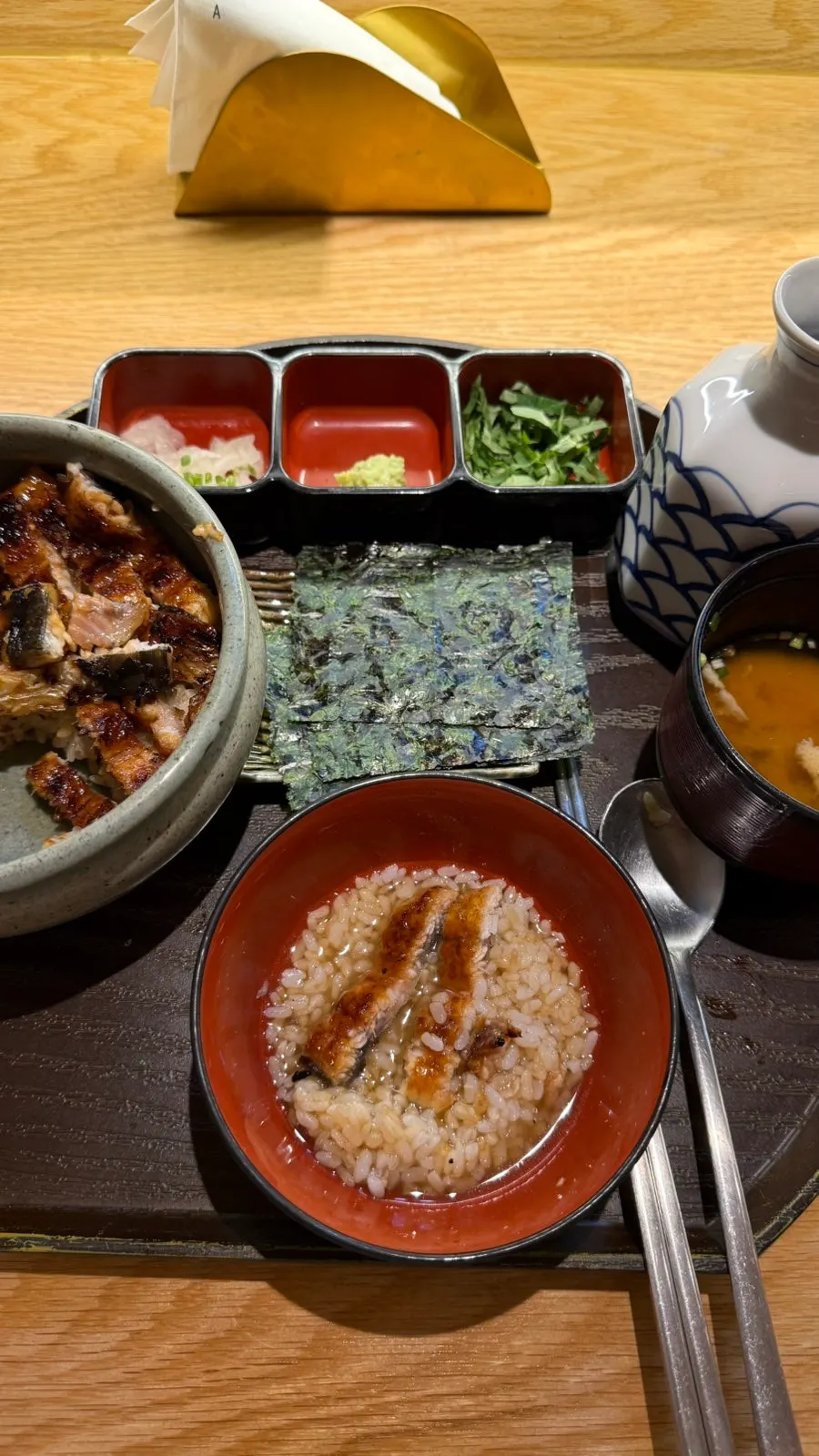 Hitsumabushi topped with scallion, seaweed, and wasabi