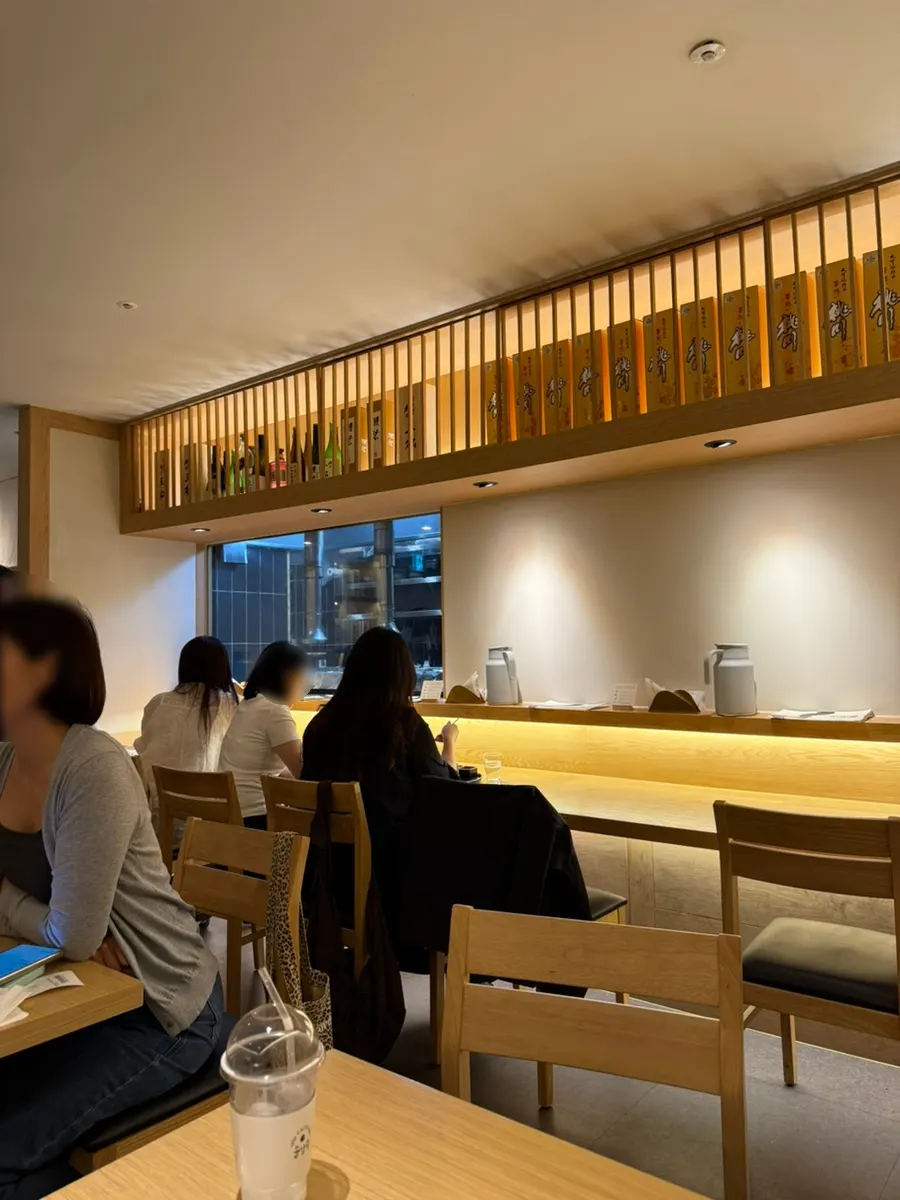 Interior of Tawa with wood-tone counter seats and private room