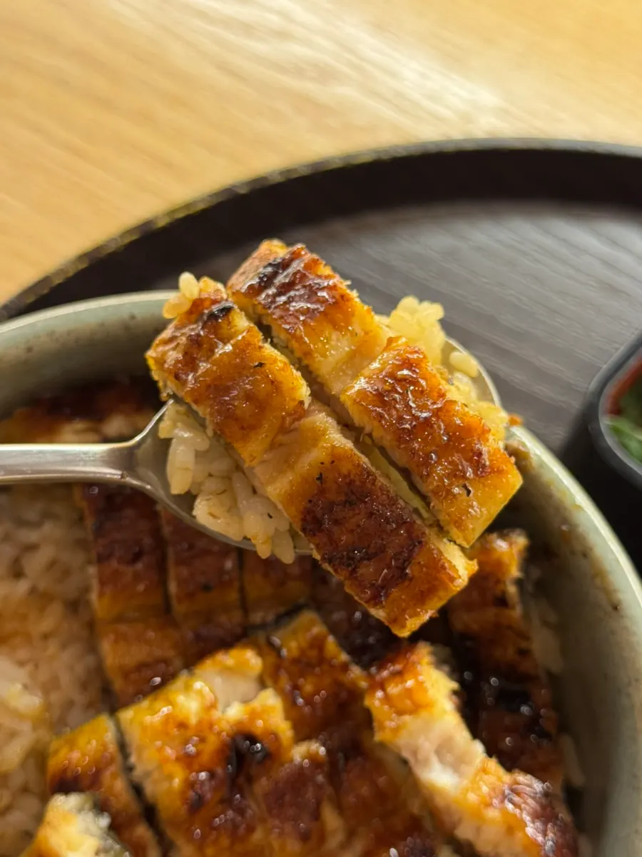 A piece of eel placed on top of the rice