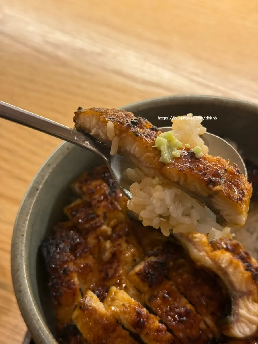 A piece of eel placed on top of the rice