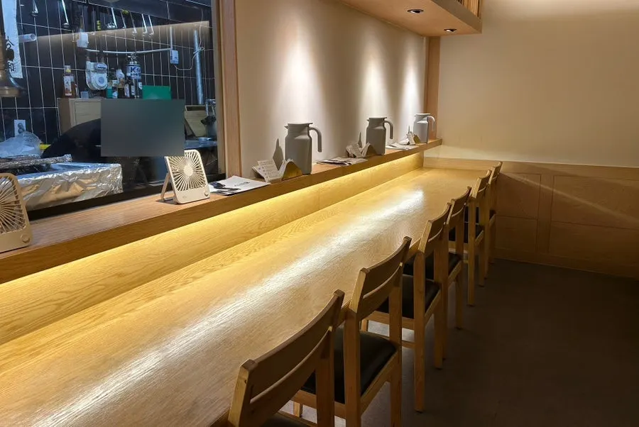 Dining hall with counter seats and tables
