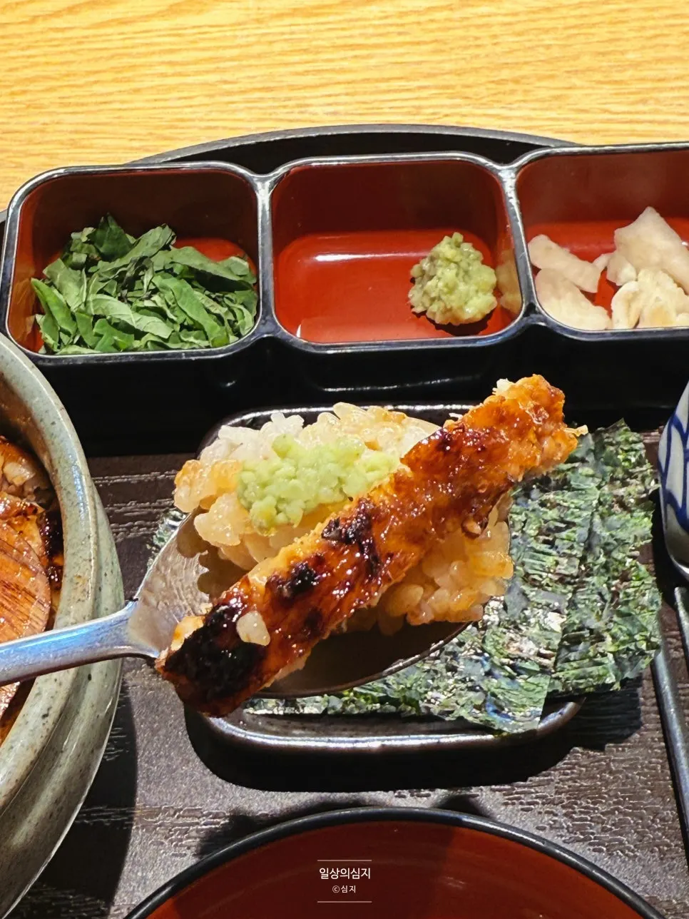 Close-up of eel rice bowl coated in sauce