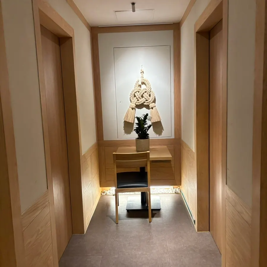 Tawa interior with wood decor and lighting