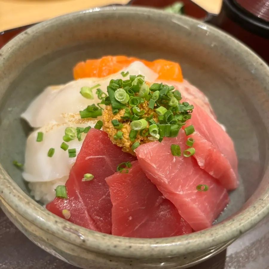 A bite of kaisendon topped with wasabi