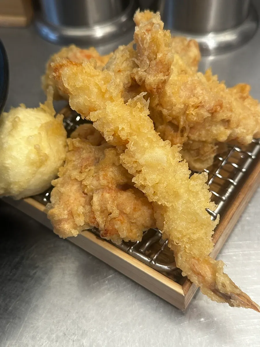 Dipping karaage into yuzu-scented sauce