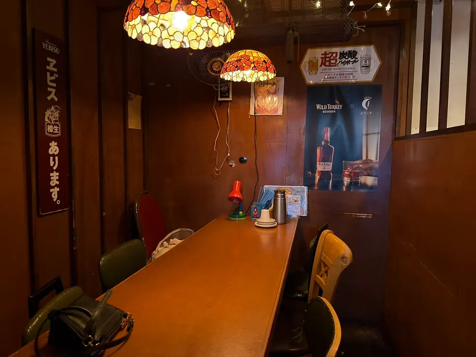 Bar seating and tables inside Tenjo