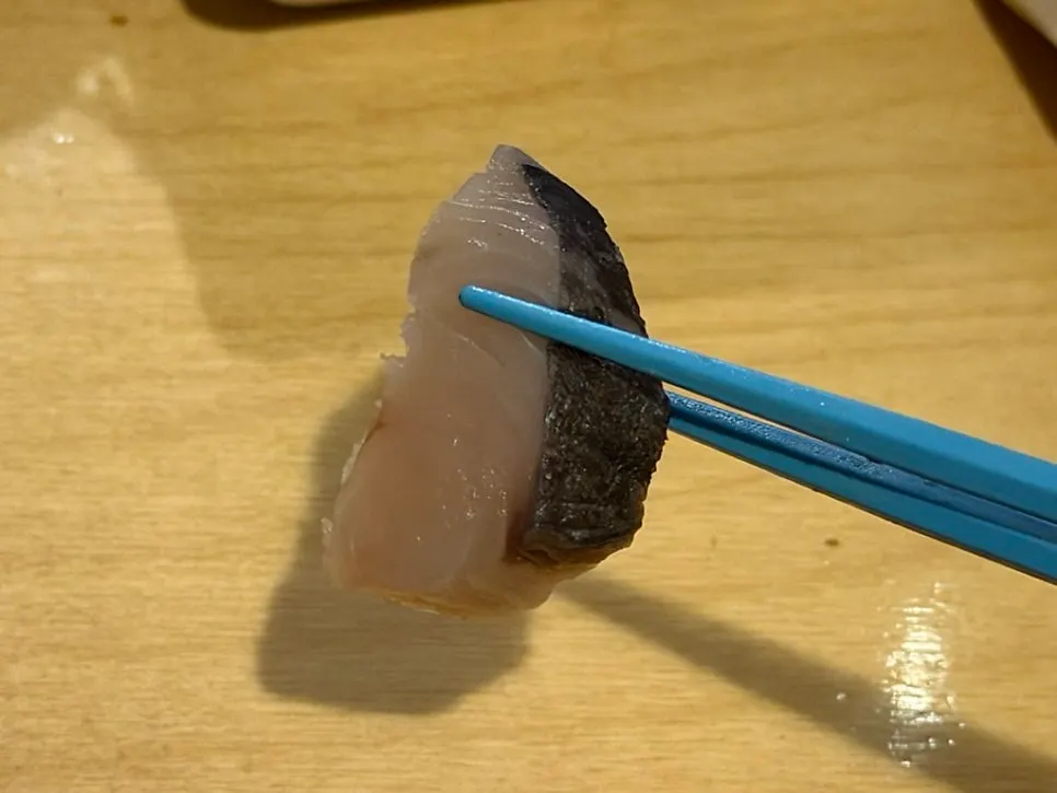 Aged sashimi with a cup of tokkuri sake