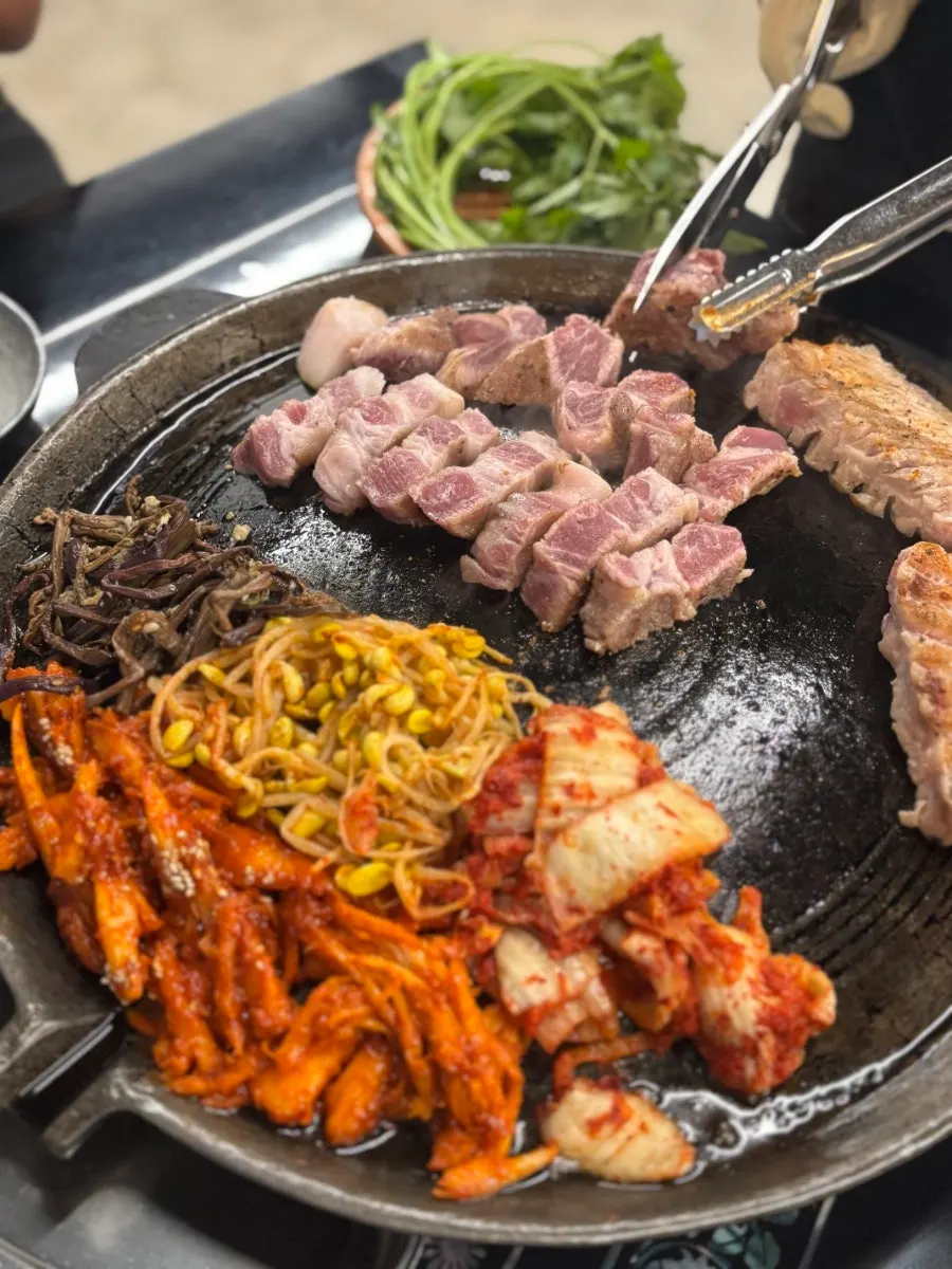 Kimchi and bean sprouts grilling together on the grill