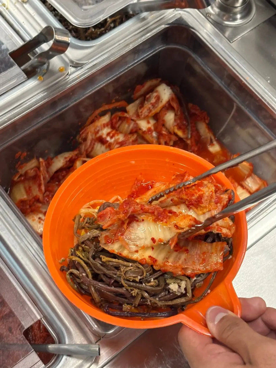 Self-bar stocked with roasted seaweed flakes and other fried-rice ingredients