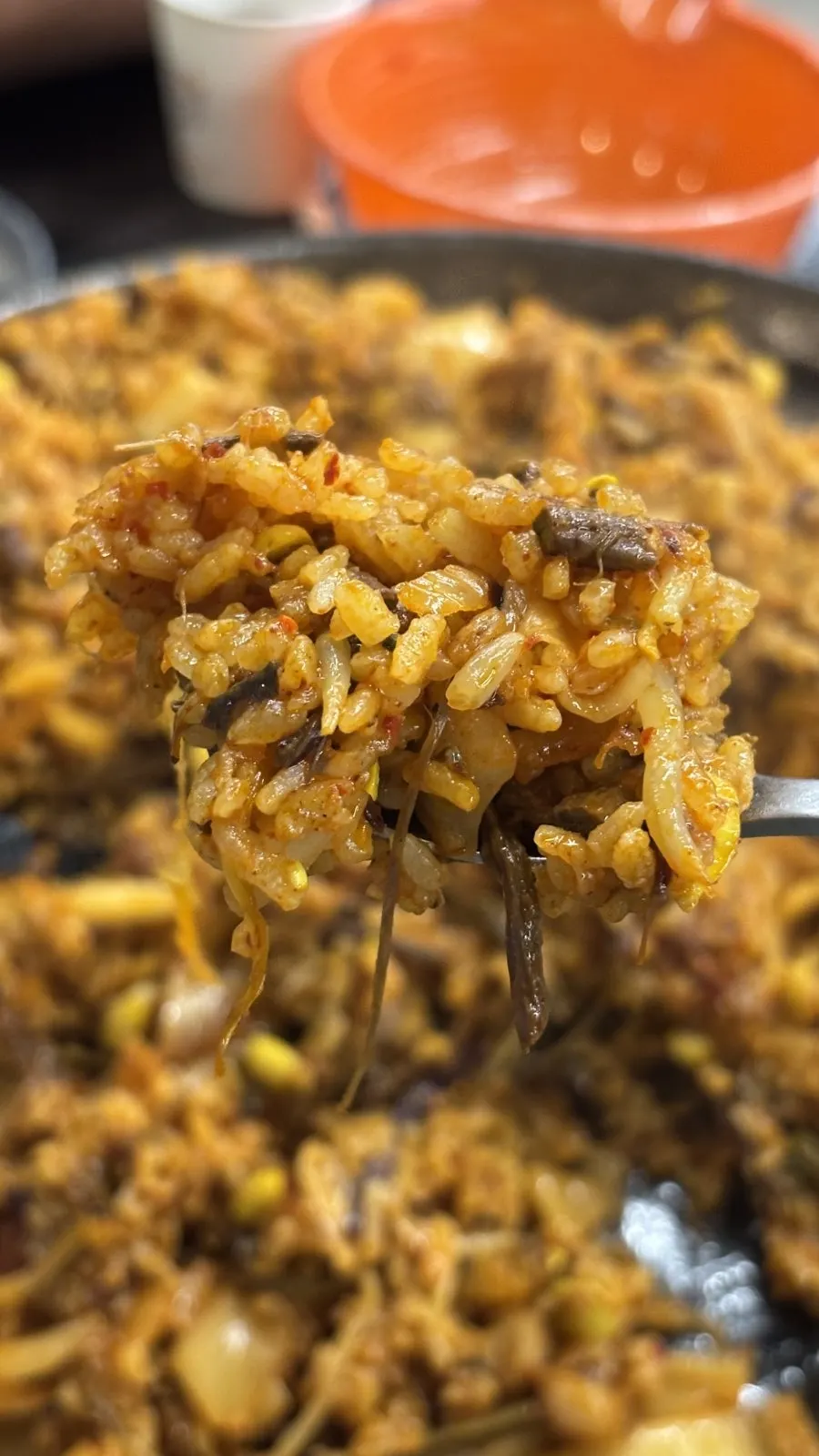 Kimchi fried rice being stir-fried directly on the grill