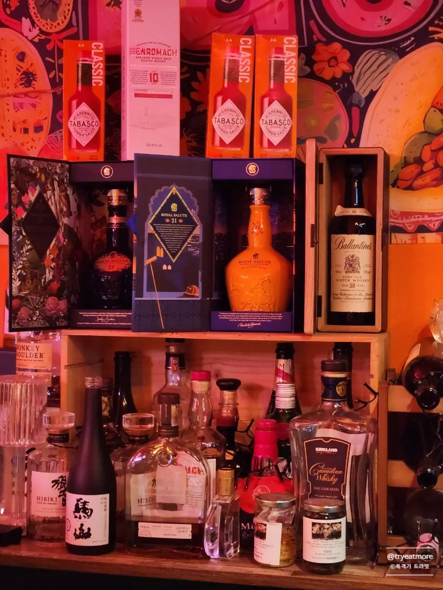 The liquor shelf mixing customers' bottles and the owner's own