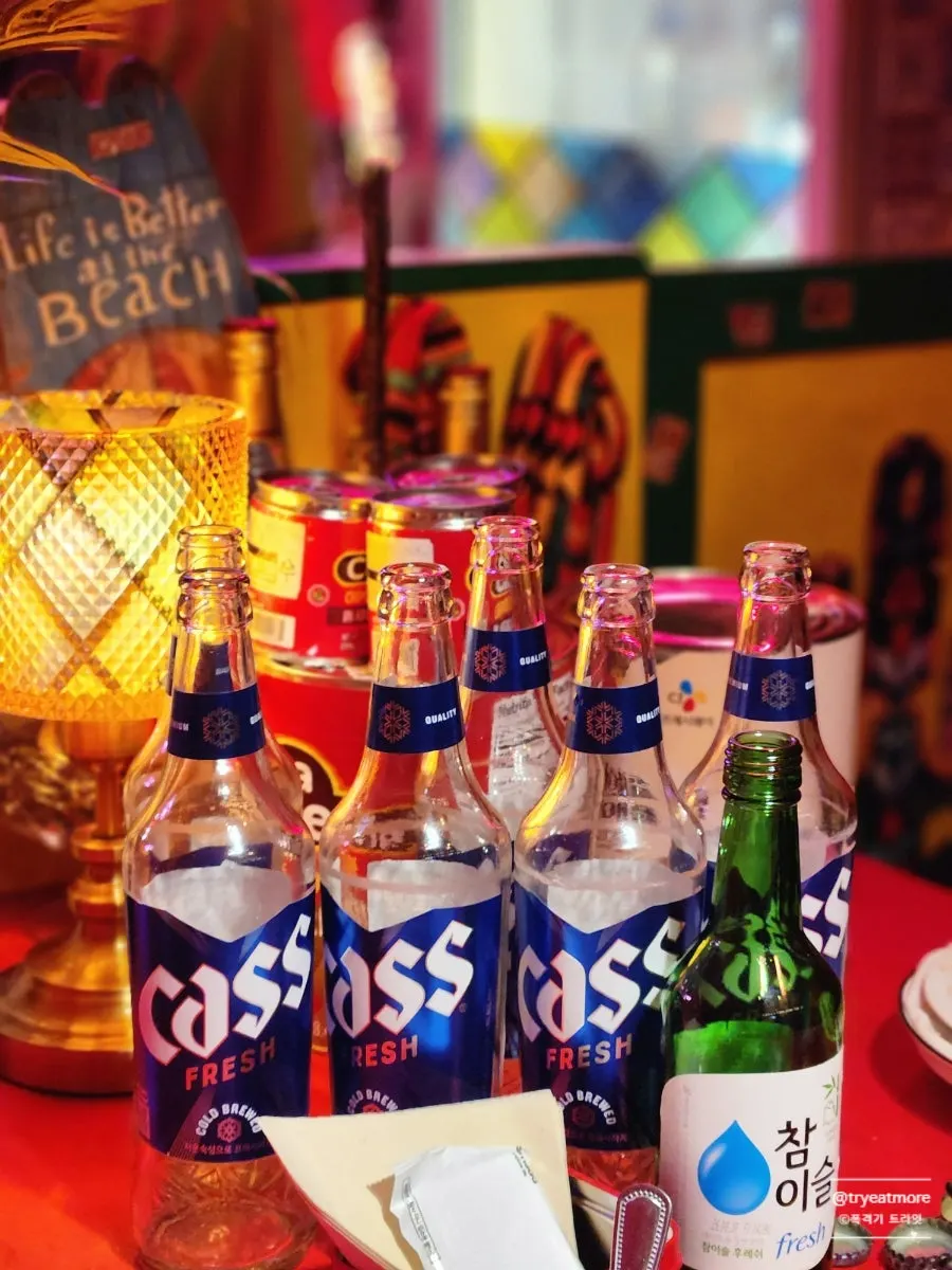 Beer bottles and drinks piling up on the table