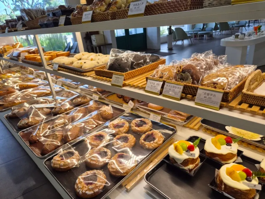Display case with sandwich loaves and cakes