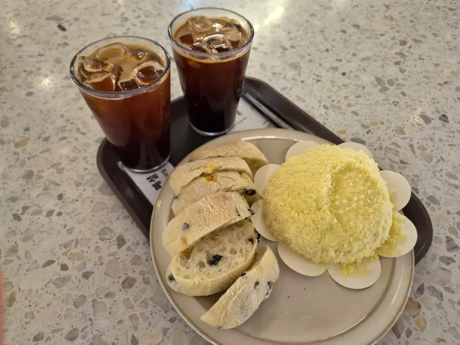 Table with two coffees and two bakery items