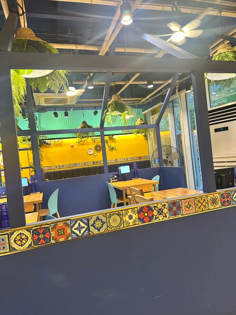 Spacious dining hall at Thanon55 with group seating