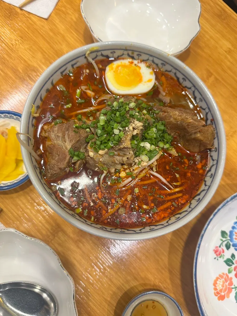 A bowl of pork bone rice noodle soup at Thanon55