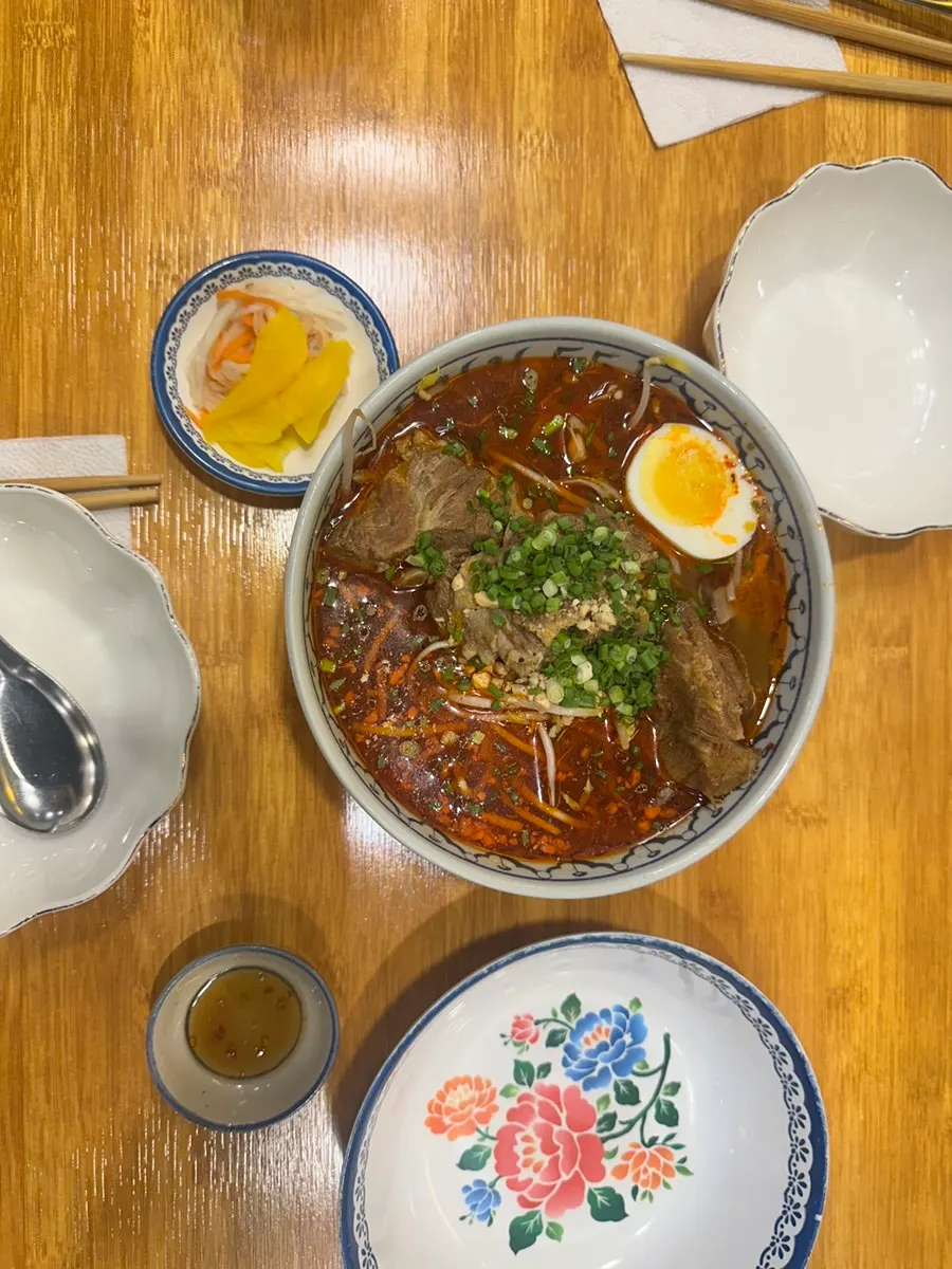 Close-up of the noodles and broth in the pork bone rice noodle soup