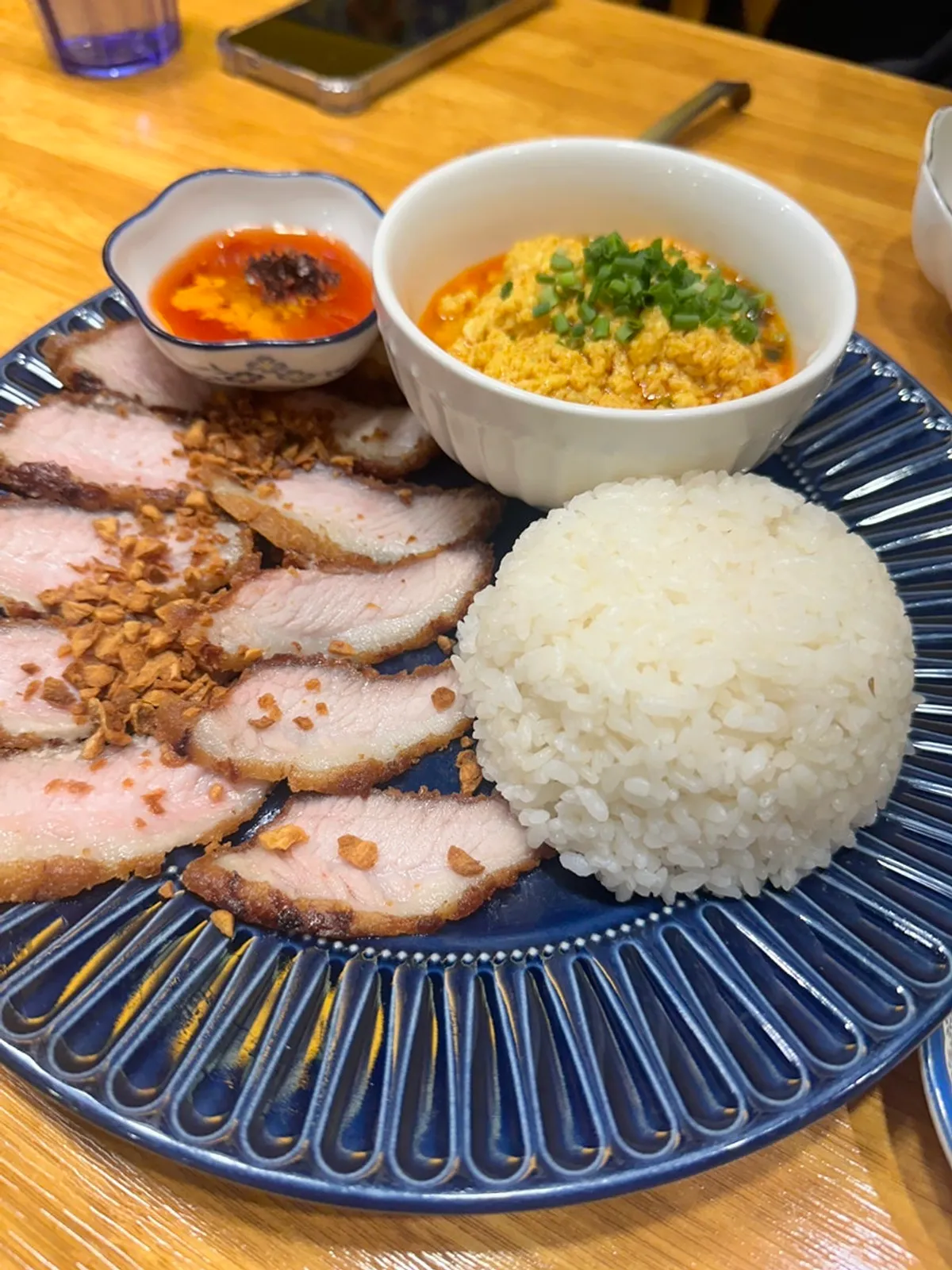 Pork cutlet curry served with fried pork, curry, and rice