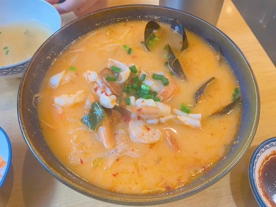 Tom yum broth with seafood