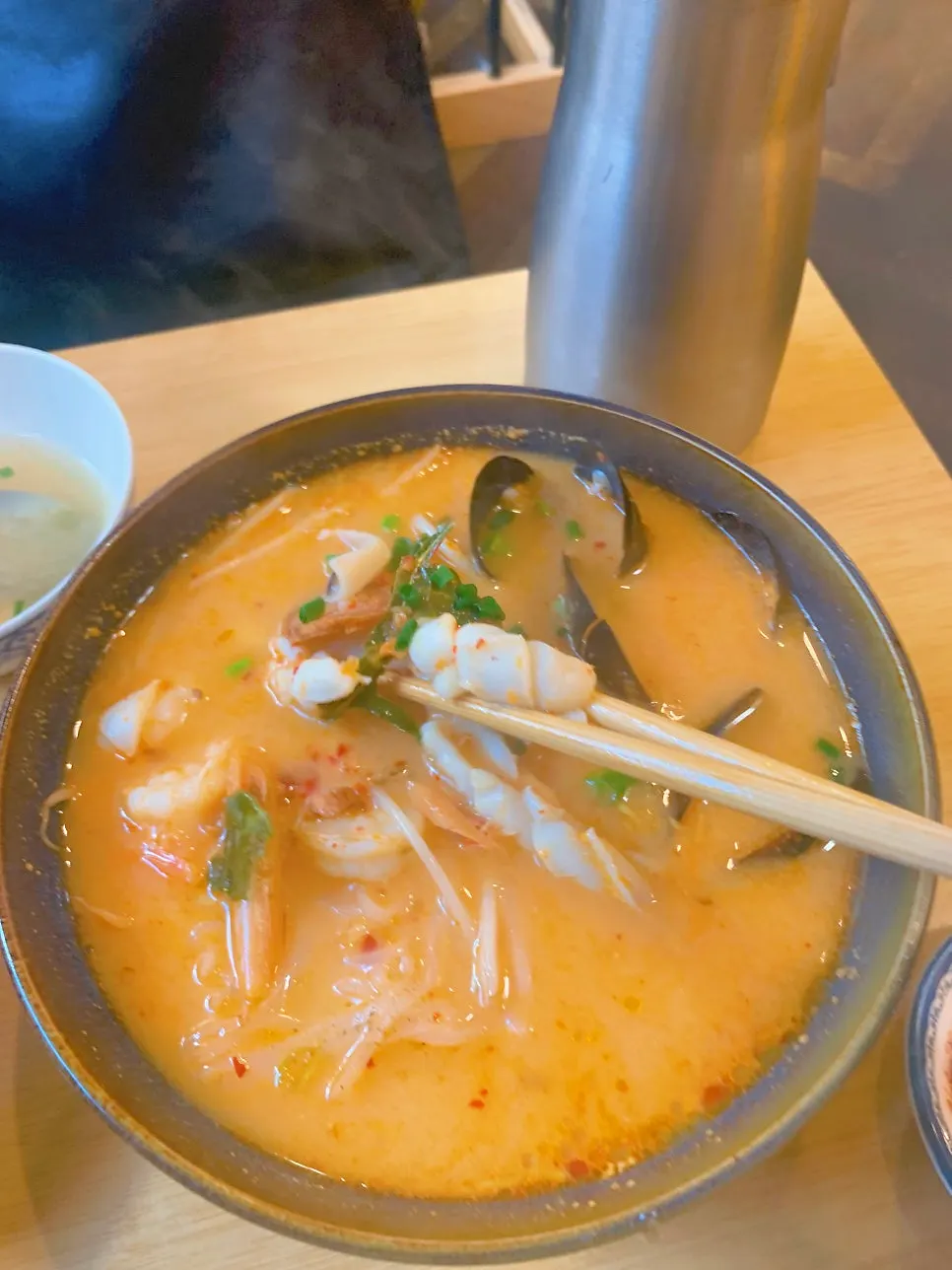 Choosing between pho and tom yum at Thanon55