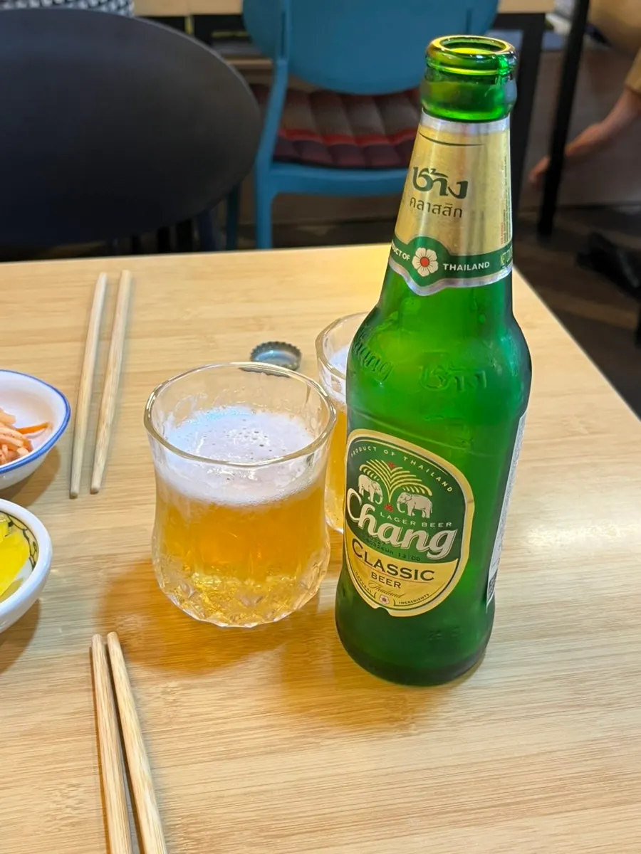 Thai-style pickled chilies and chili sauce on the table