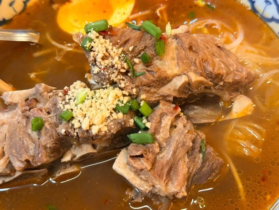 Broth and noodles of the gamjatang pho