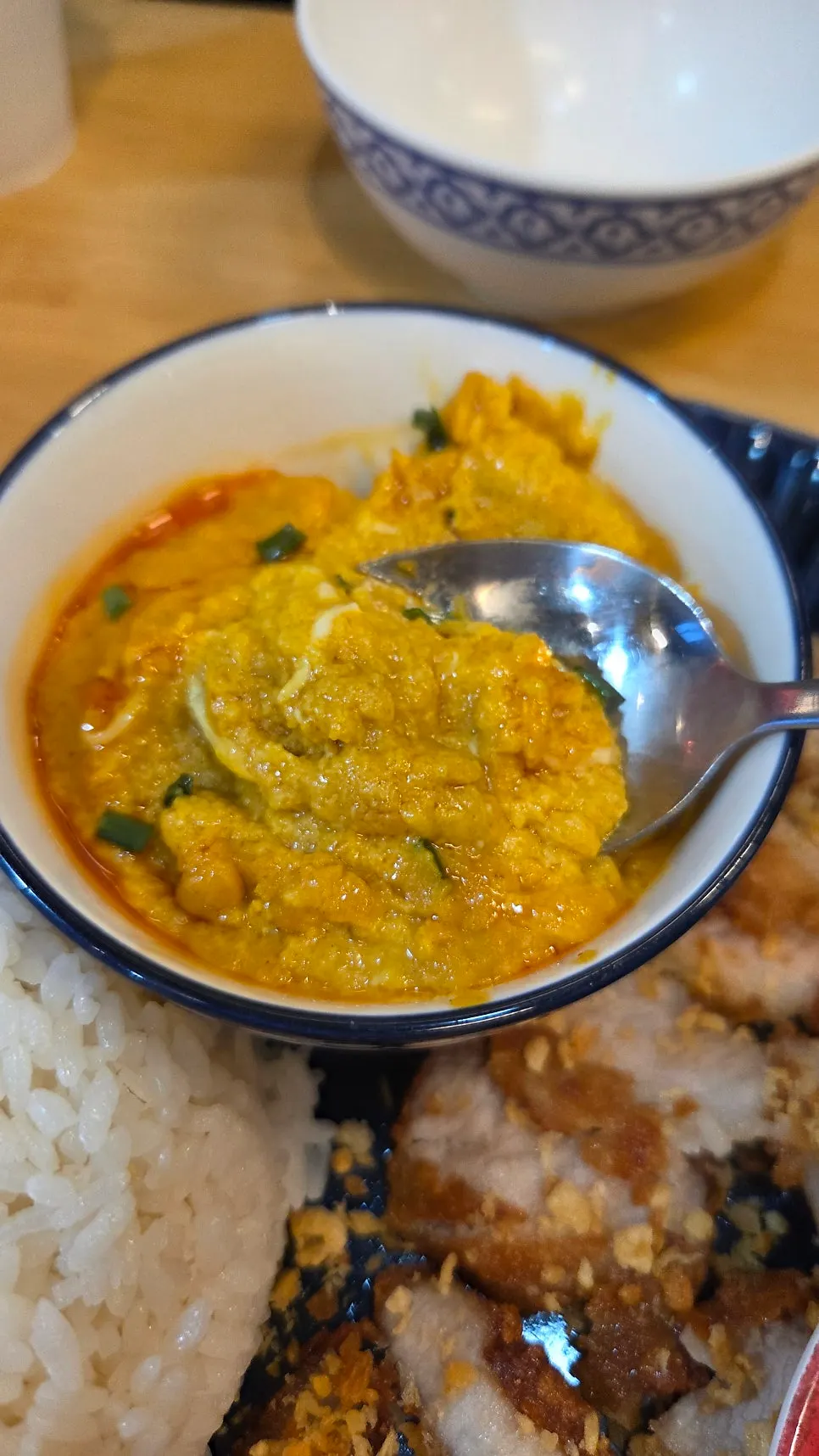 Crispy fried pork topping the mu thod curry