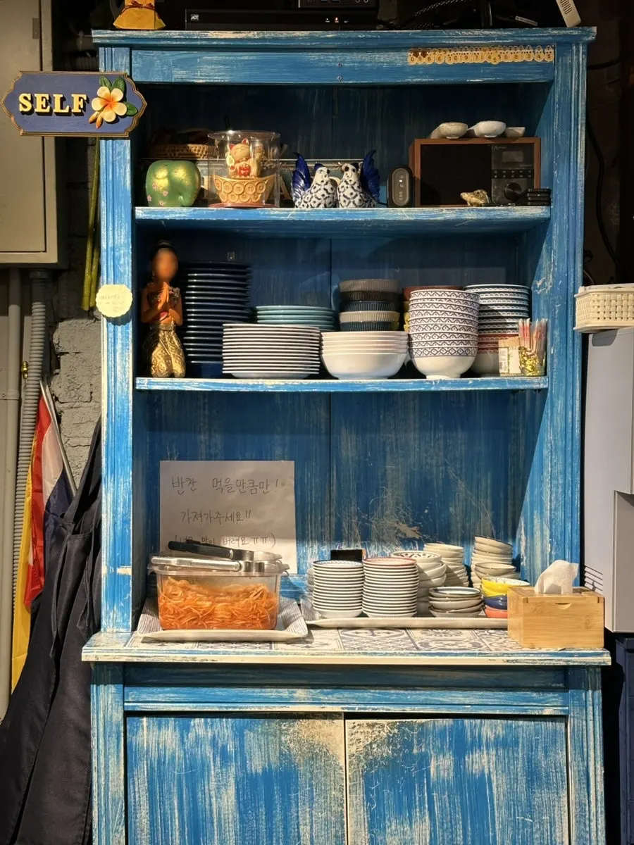 Interior decorated with yellow and blue patterned tiles