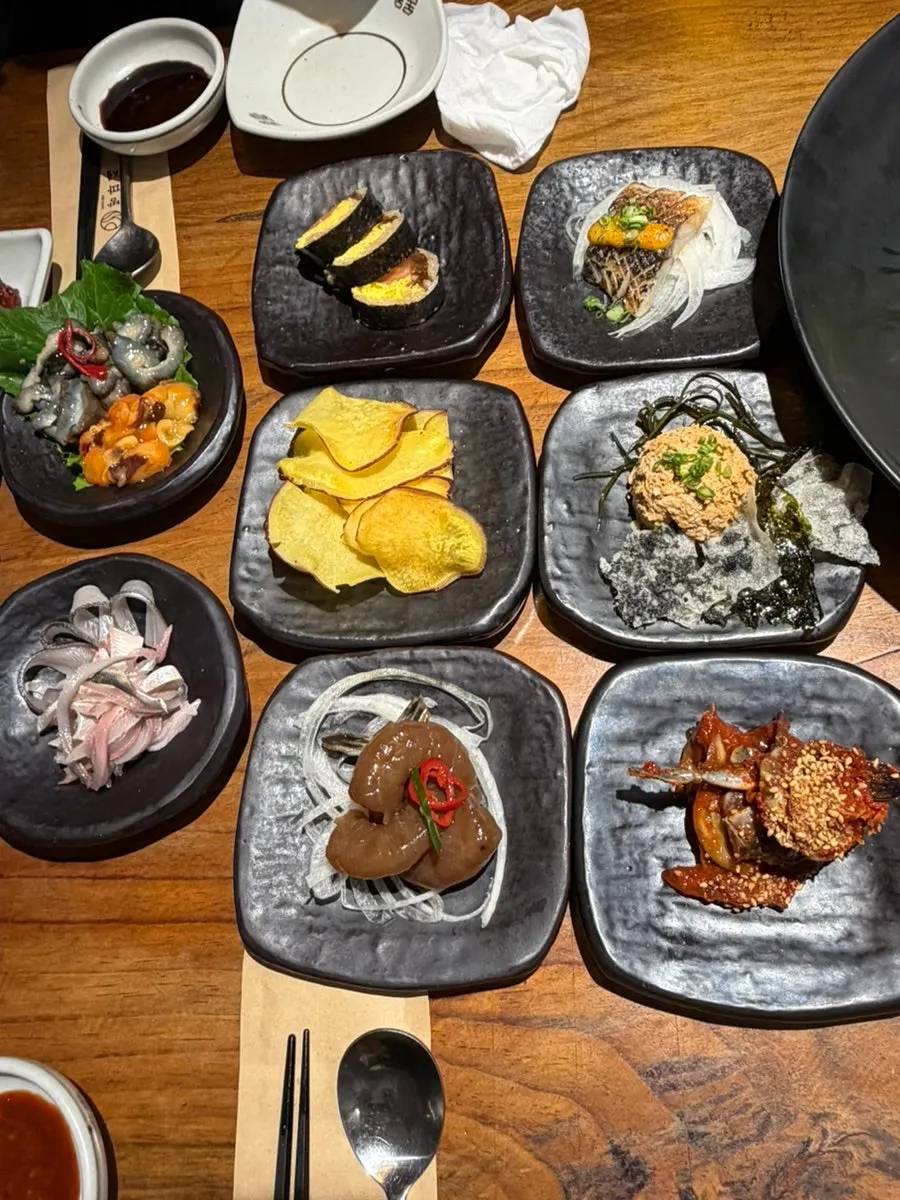 Plate of seasonal assorted sashimi with vegetables