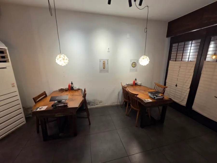 View of The Bangpaje's 1st floor hall with wood-toned interior