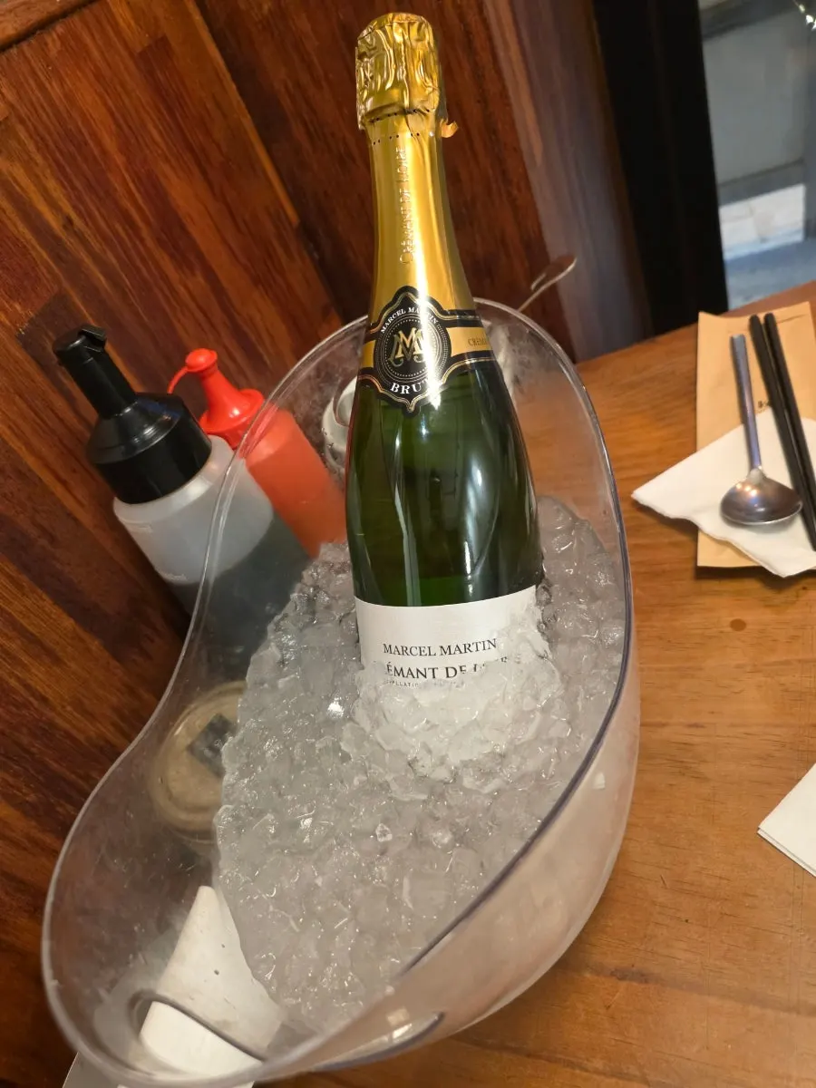 Chilled wine brought in for corkage, with wine glasses