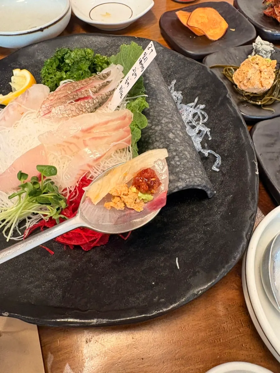 Seasonal assorted sashimi of milchi, flounder, sea bass, and hirame
