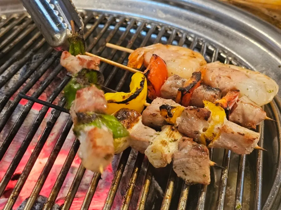 Grilled meat wrapped in fresh greens