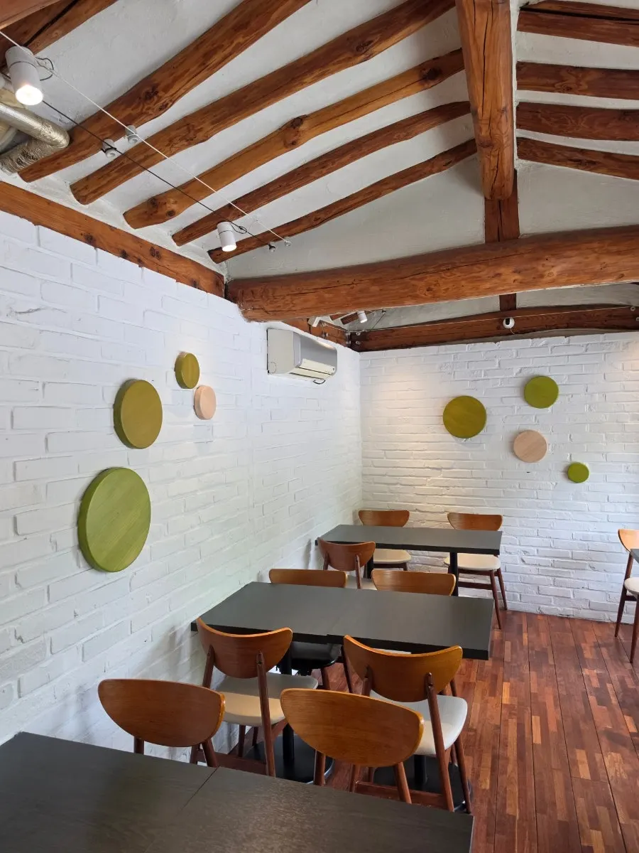 4-person and 2-person table area at the back of the 2nd floor