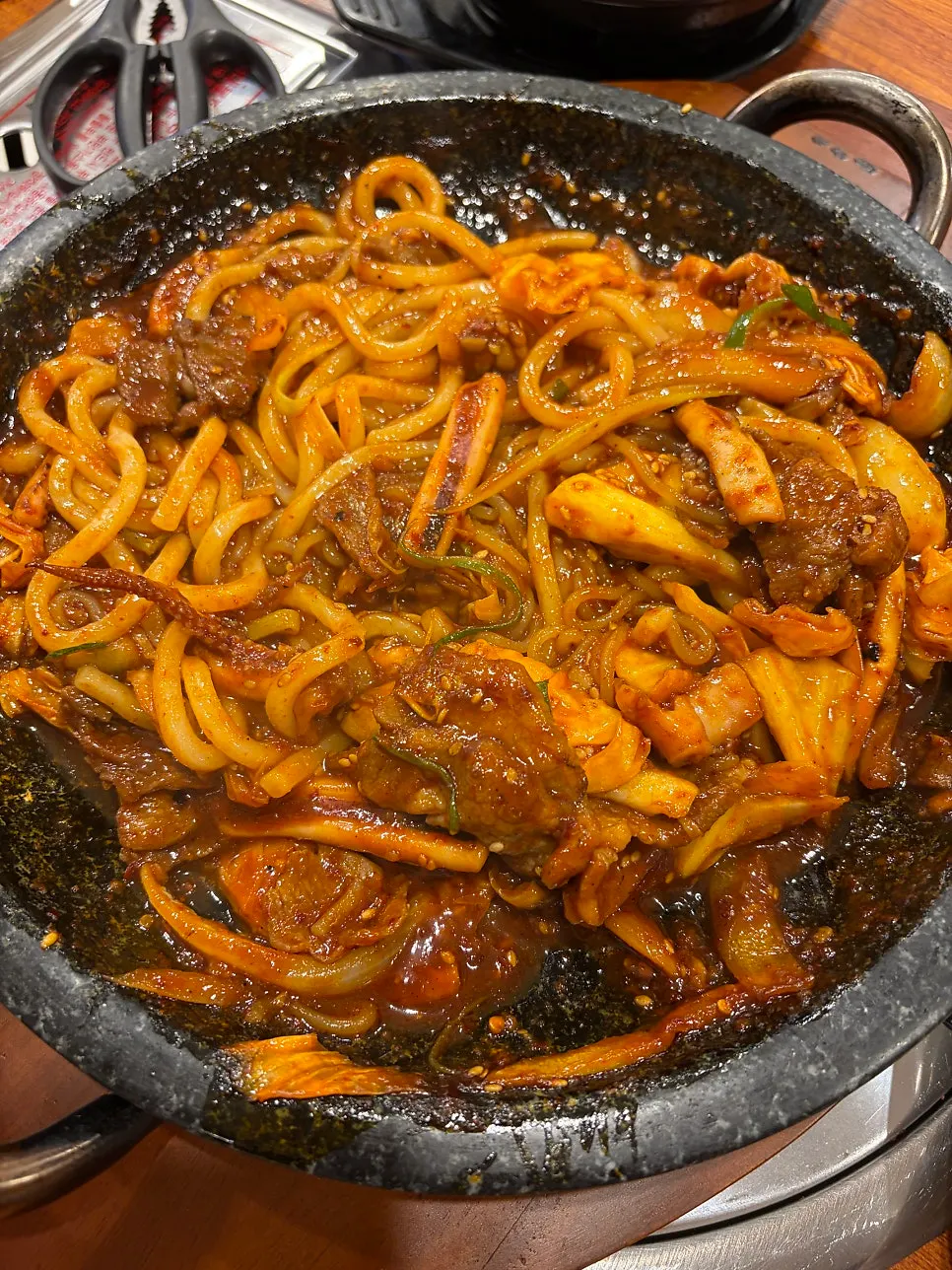 A bite of sauce-coated udon noodles