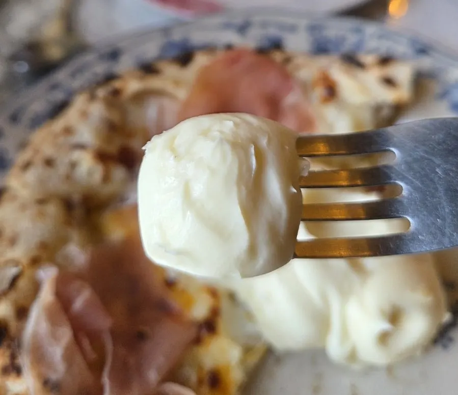 Close-up of creamy ricotta cheese topping