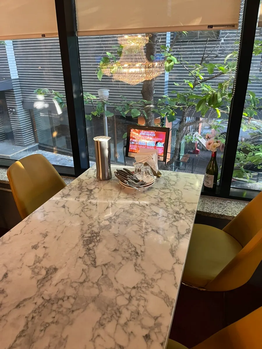 Window-side table with a tree visible outside