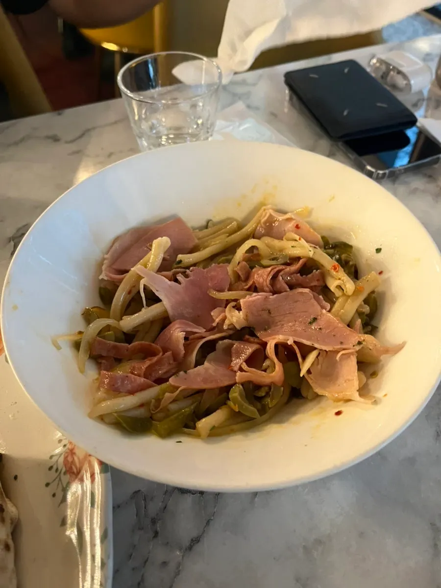 Fresh pasta showing olives and onion