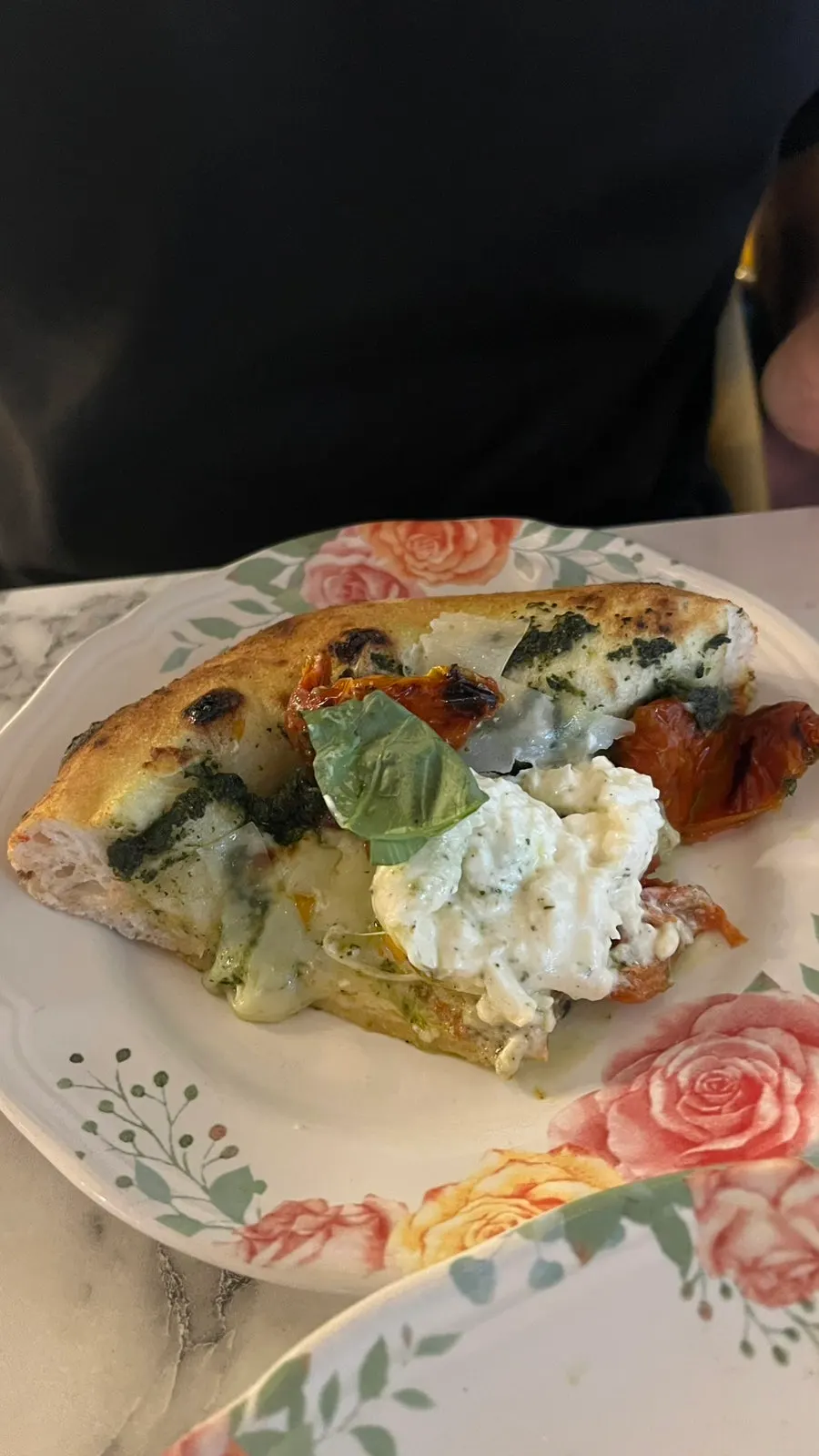 Tearing apart the burrata cheese