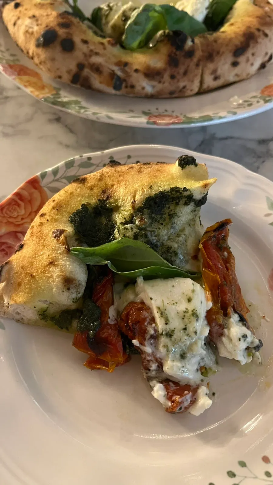 A slice of pizza transferred to a plate