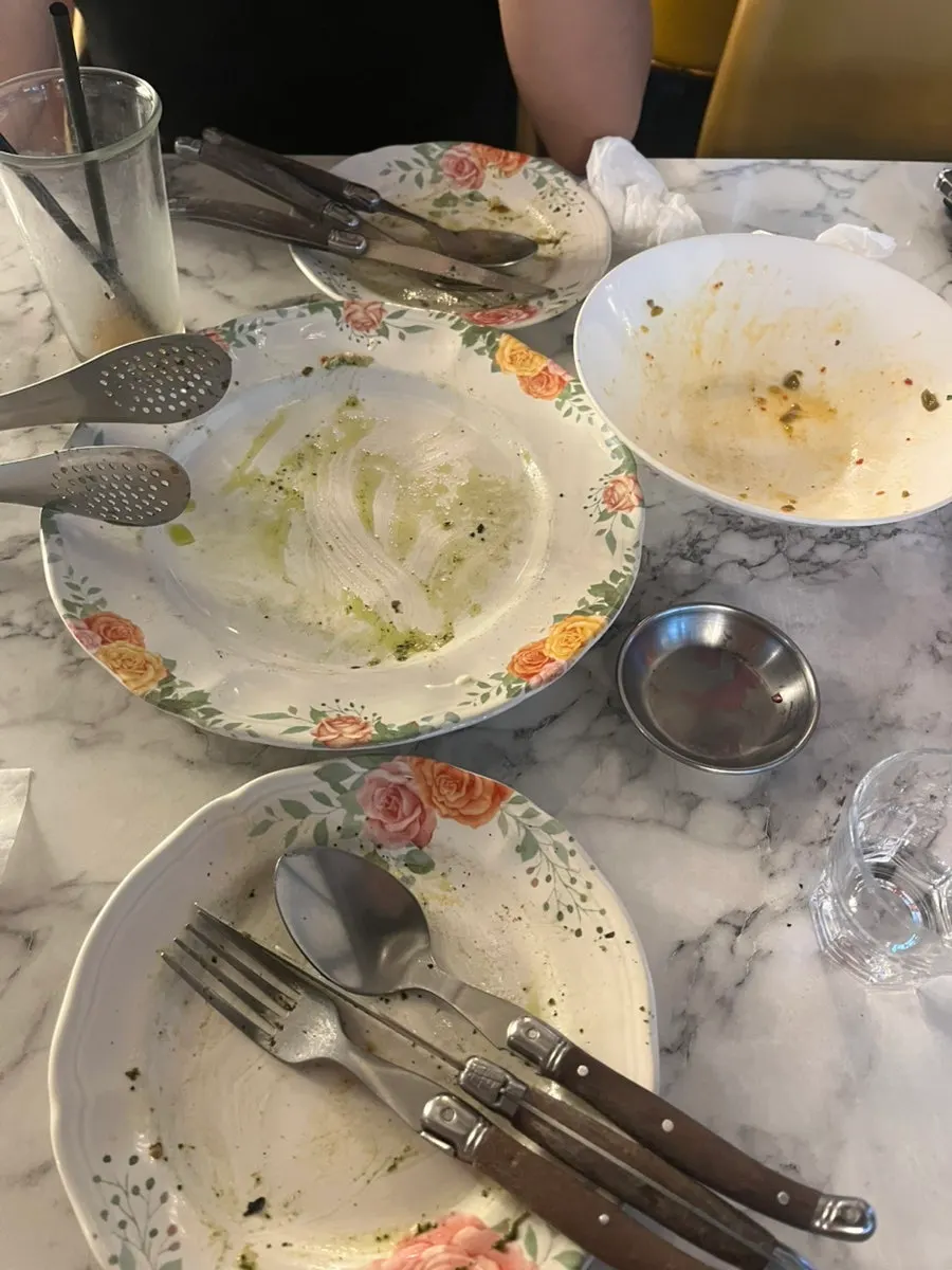 Empty plates after finishing the pizza and pasta