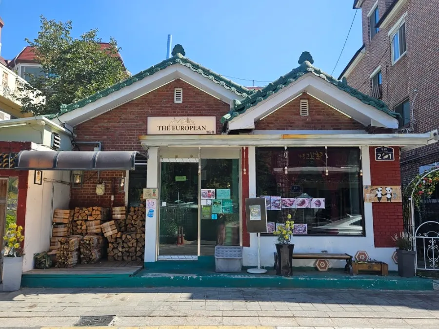 Exterior of The European Haenggung Main Branch with red brick and tiled roof