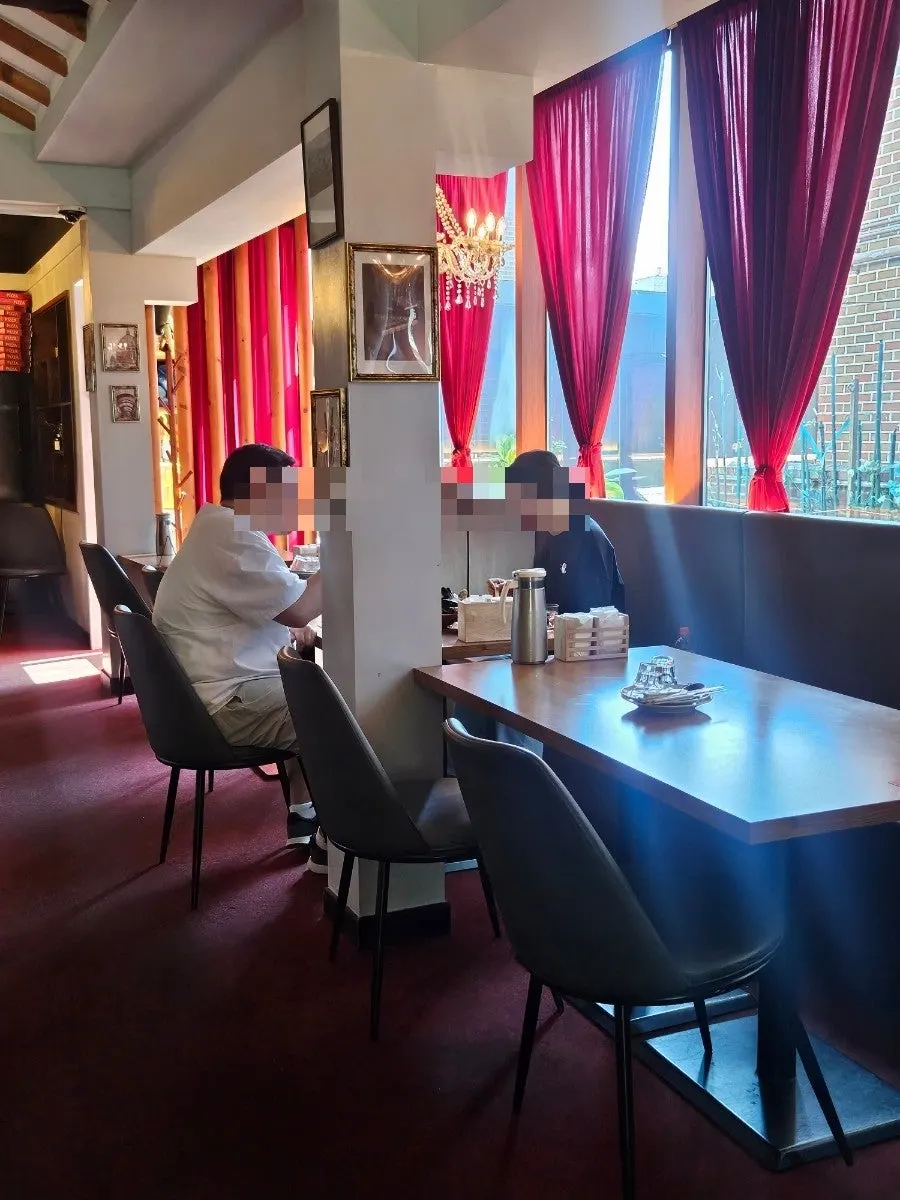 View of the 84-seat dining room with mostly 4-person tables