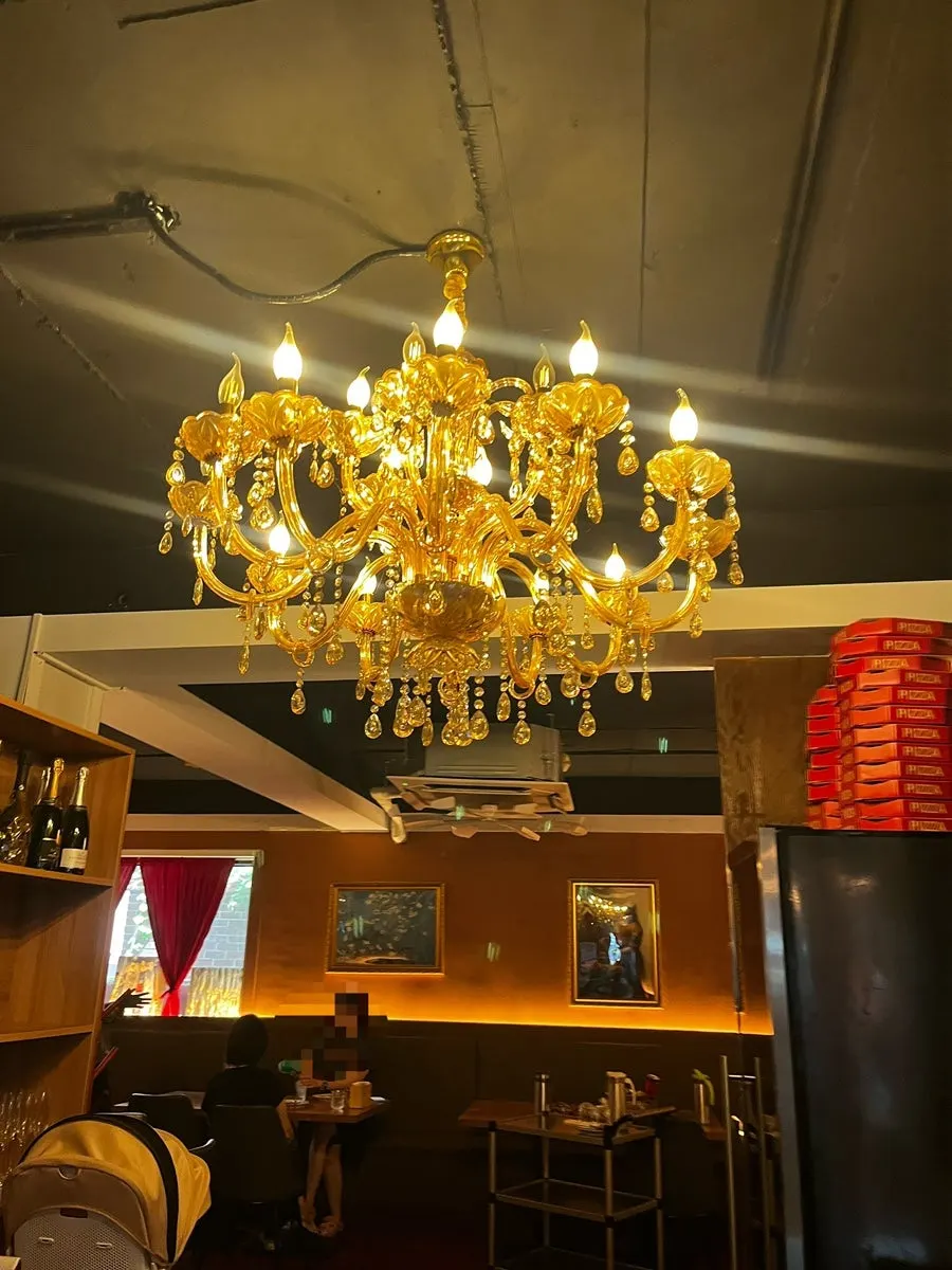 Chandelier lighting inside the wood-fired pizza restaurant