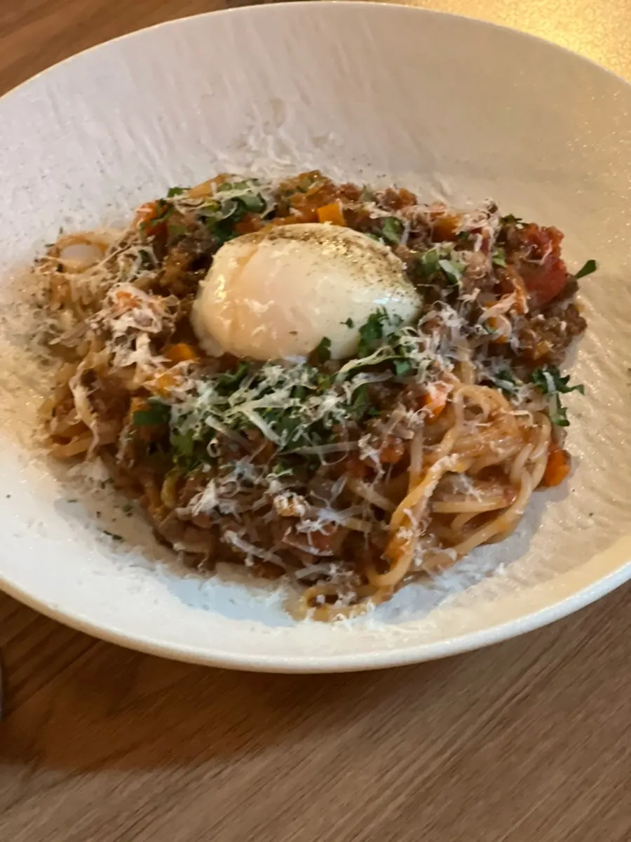 Close-up of the pasta with generous ragu sauce