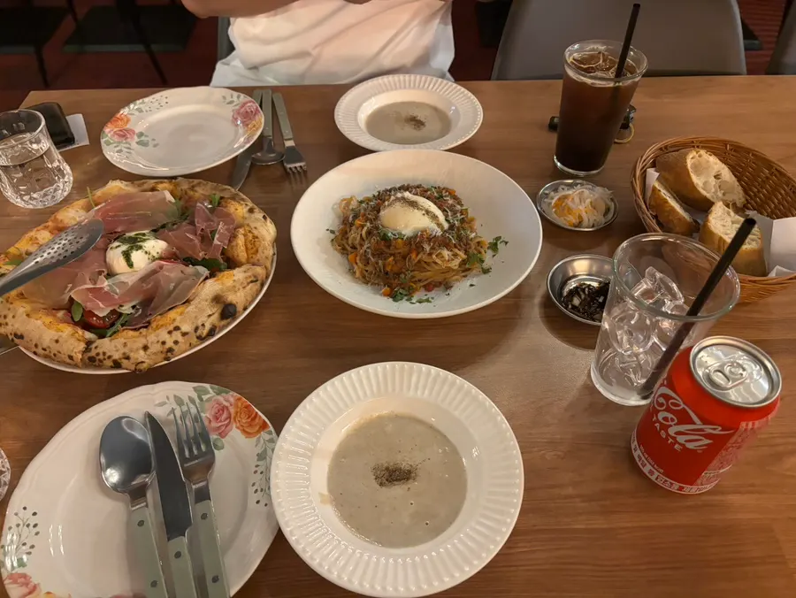 Pizza and pasta laid out on the table